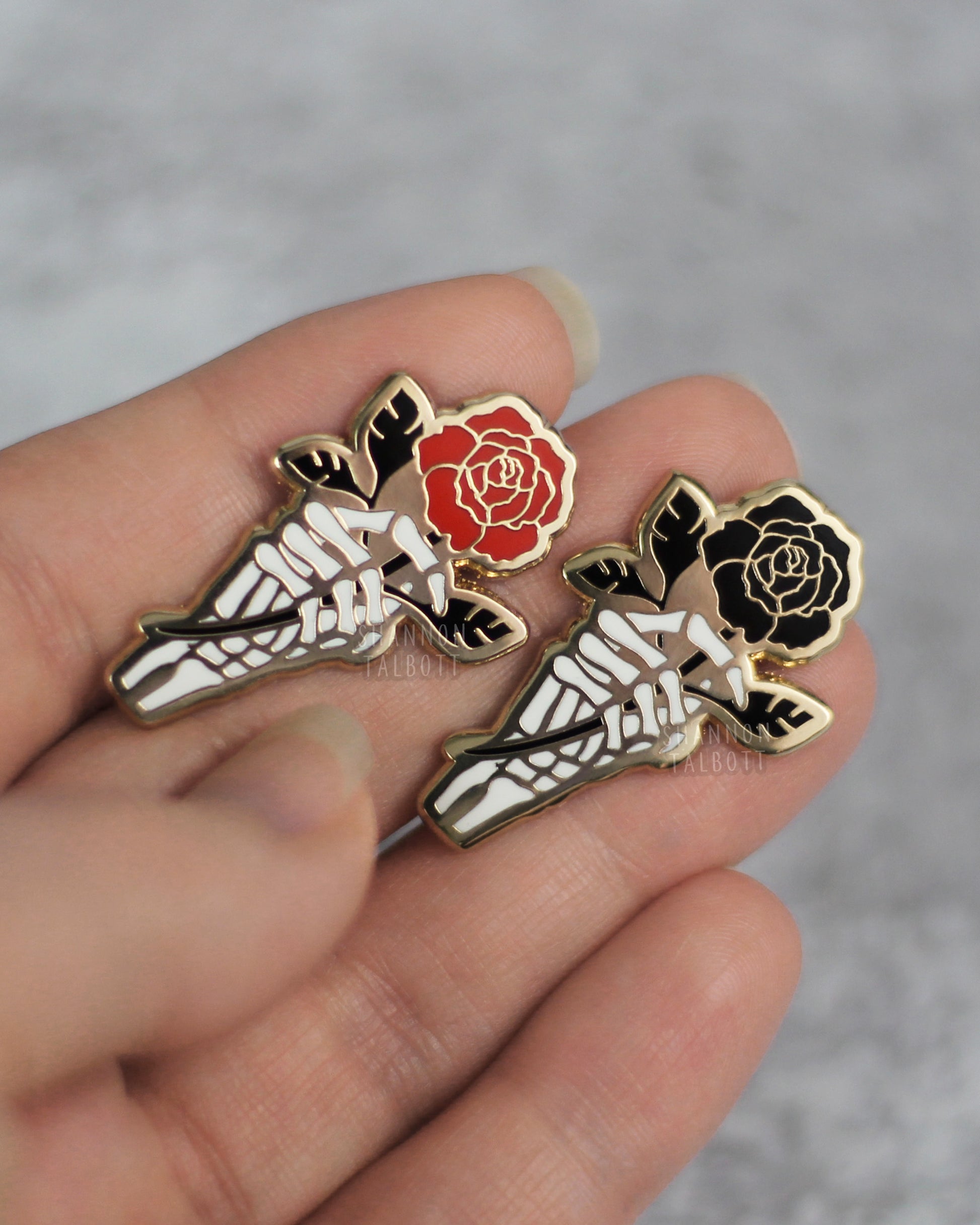 Skeleton Hand Holding Rose Enamel Pin in Gold