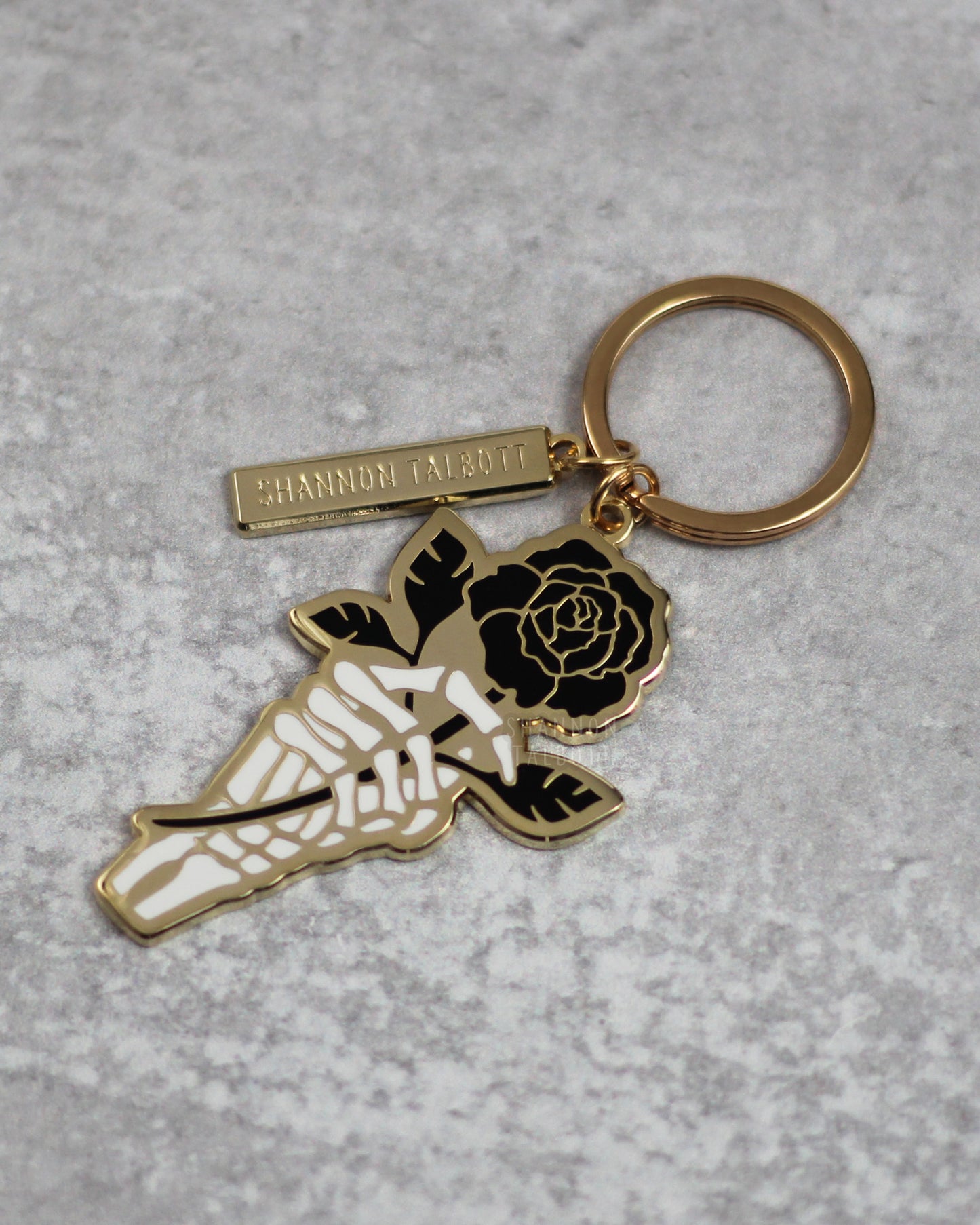 Skeleton Hand Holding Rose Enamel Keychain in Gold